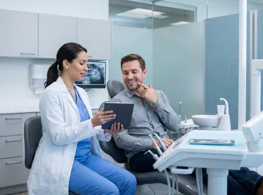 Understanding a Dark Spot on Tooth: Causes, Treatments & Prevention