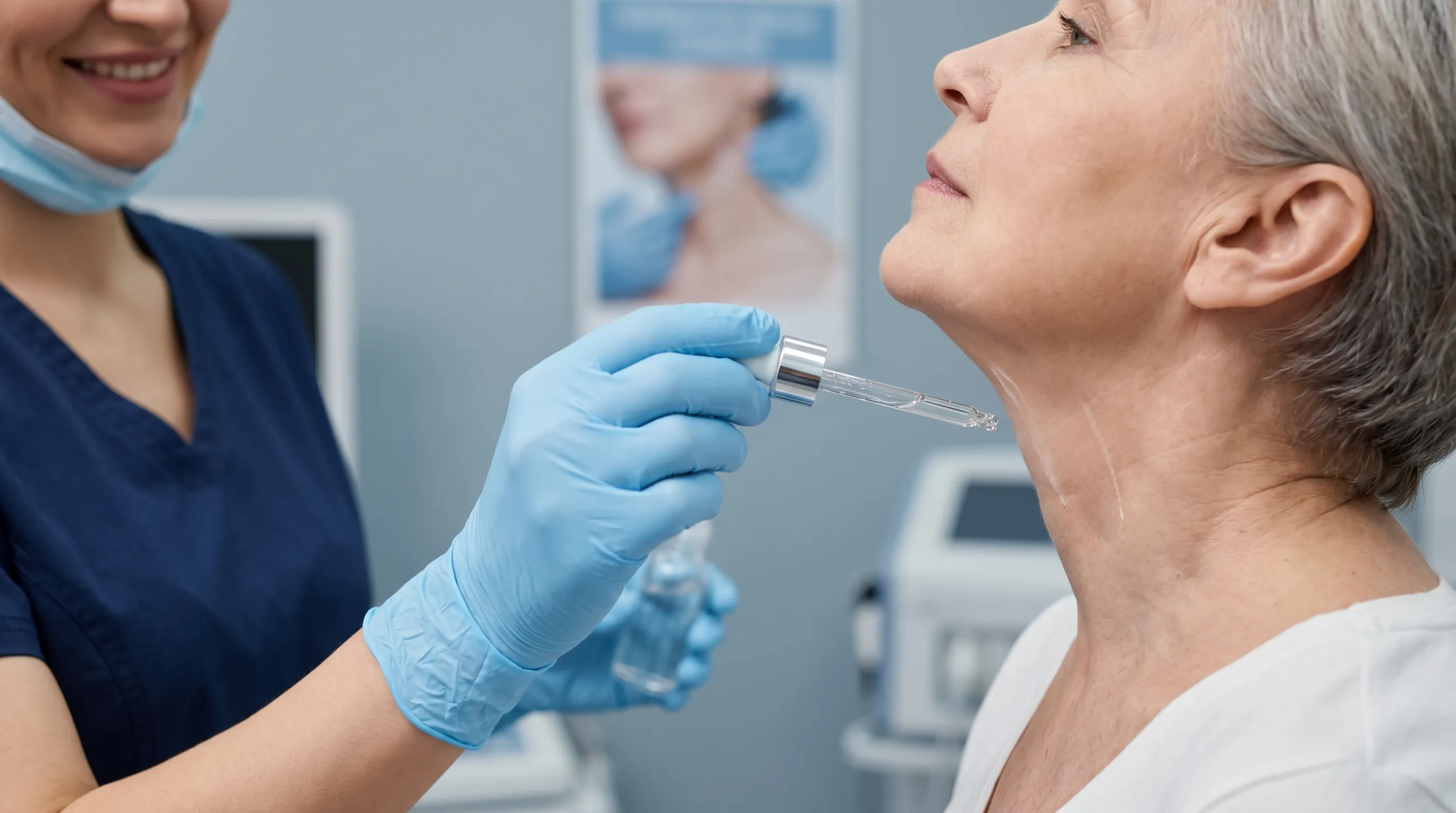 Close-up professional photo of a dermatologist demonstrating gentle upward massage strokes on a patient's neck using a clinical serum, clean medical environment, soft blue-gray lighting, 4:3 aspect ratio
